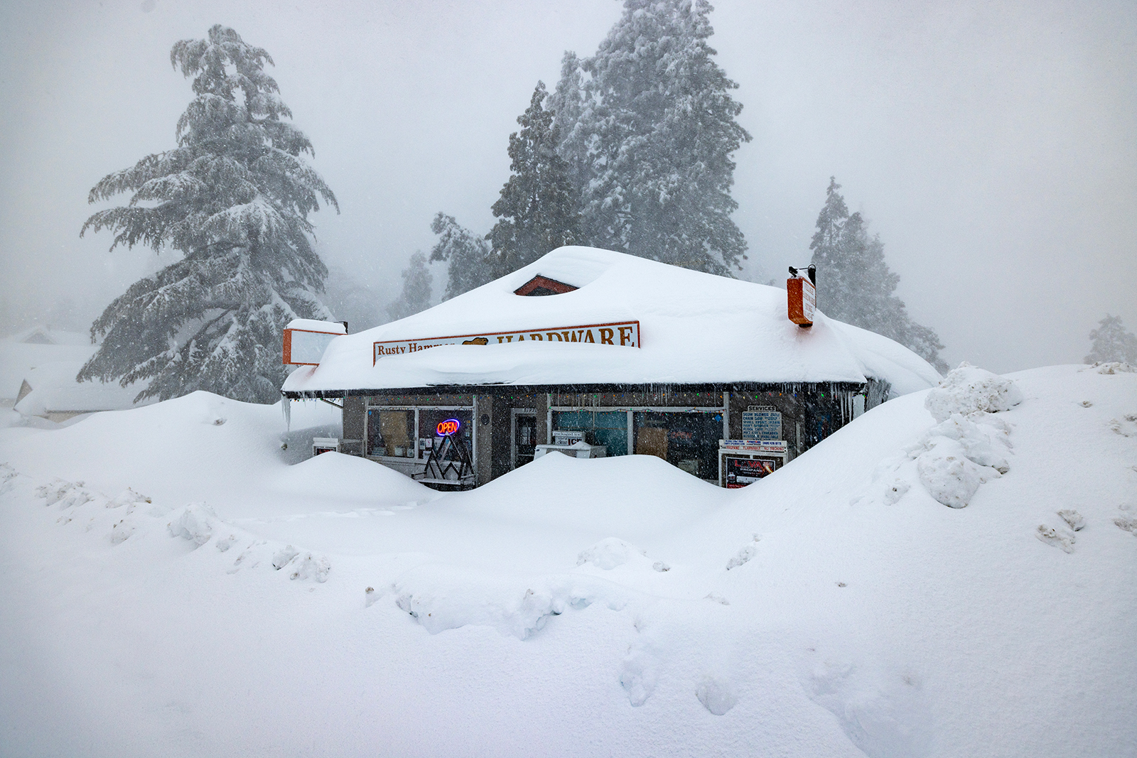 RUNNING SPRINGS, CA - MARCH 01: The open sign is still on at a business nevertheless shut down by t...