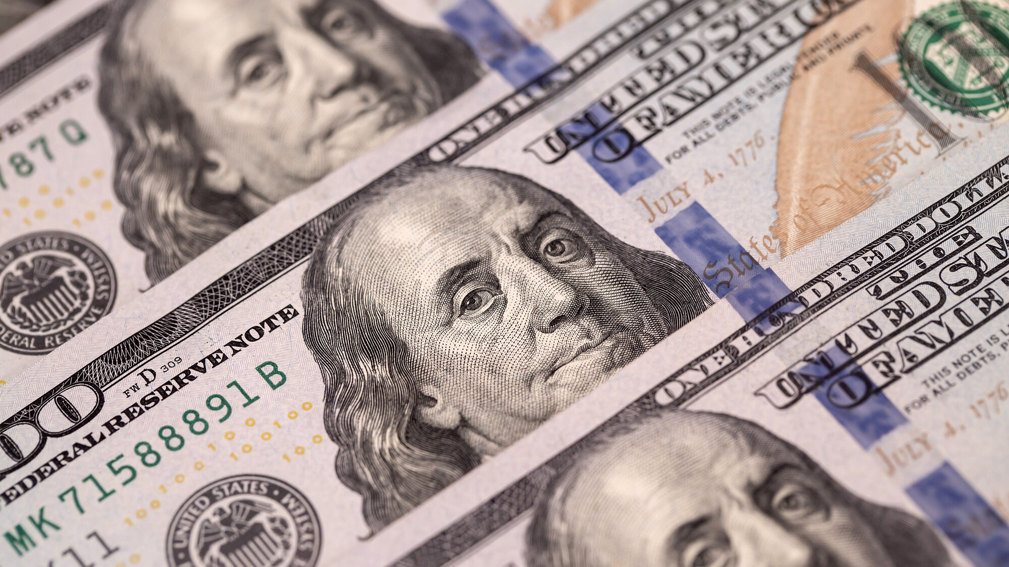 U.S. one-hundred dollar banknotes are arranged for a photograph in Hong Kong, China, on Thursday, A...
