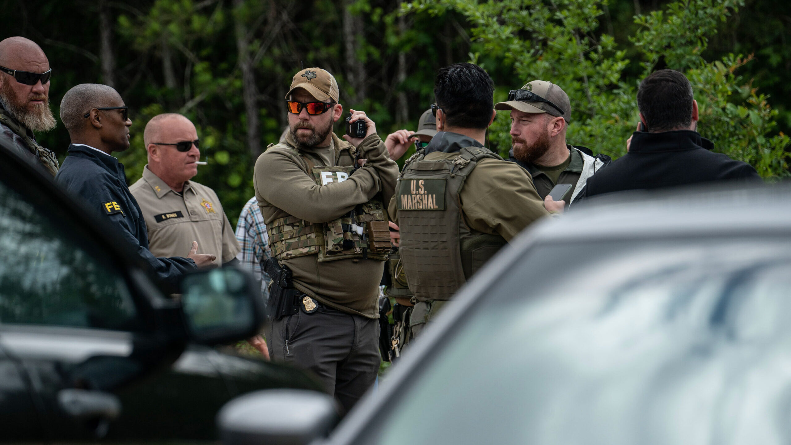 Law enforcement search for the suspect a few miles from the scene where five people, including an 8...
