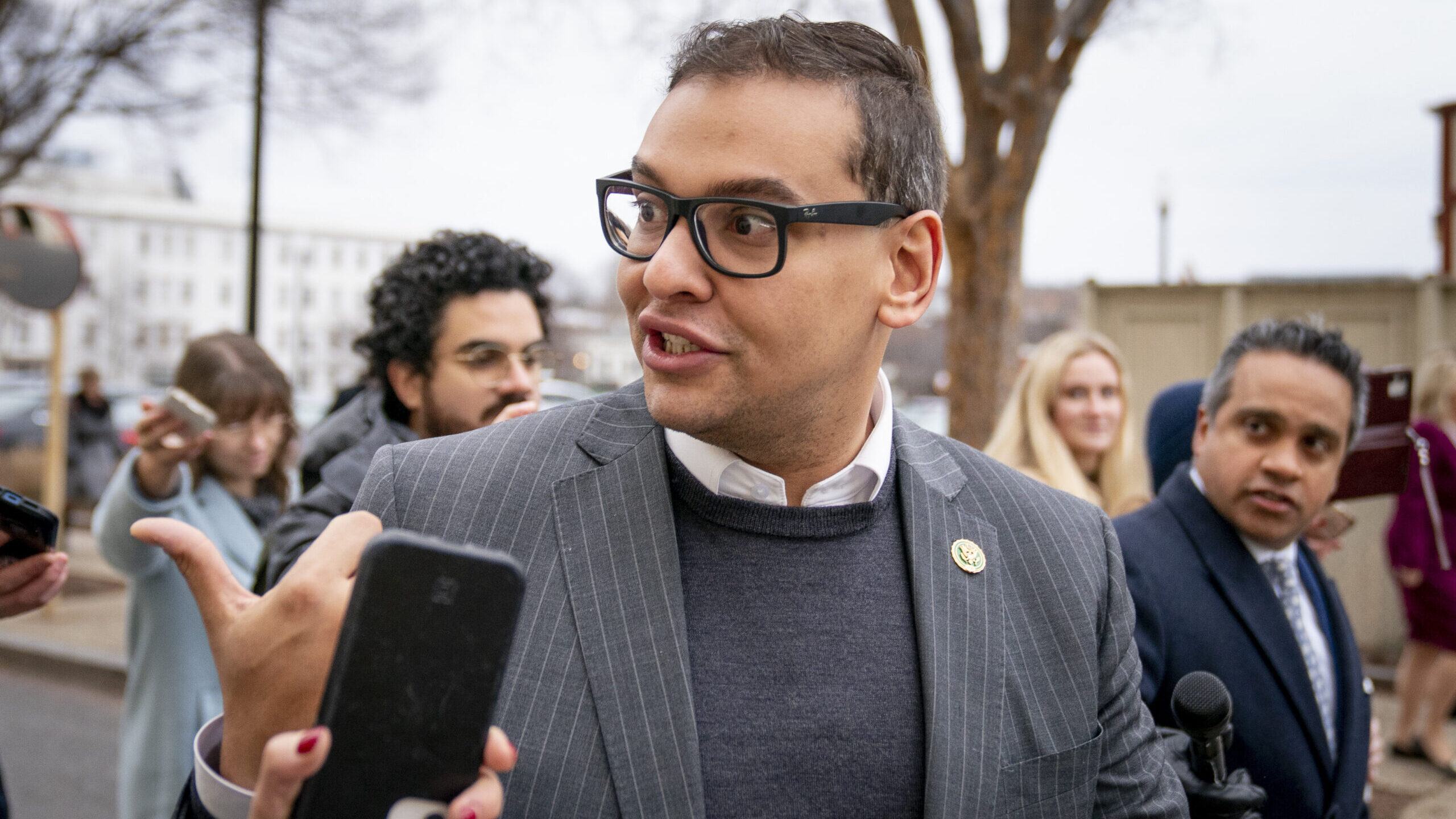 FILE - Rep. George Santos, R-N.Y., leaves a House GOP conference meeting on Capitol Hill in Washing...