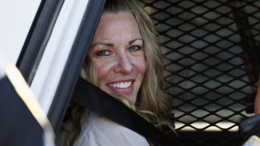 FILE - Lori Vallow Daybell sits in a police car after a hearing at the Fremont County Courthouse in...