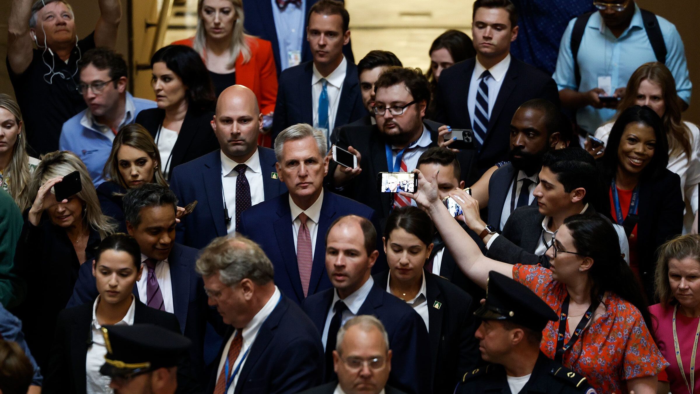 Speaker of the House Kevin McCarthy speaks to reporters as he walks through Statuary Hall in the U....