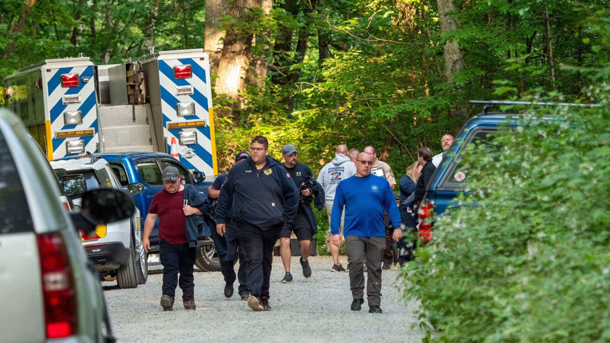 Search and rescue teams assemble before going to the site of Sunday's plane crash near Montebello, ...