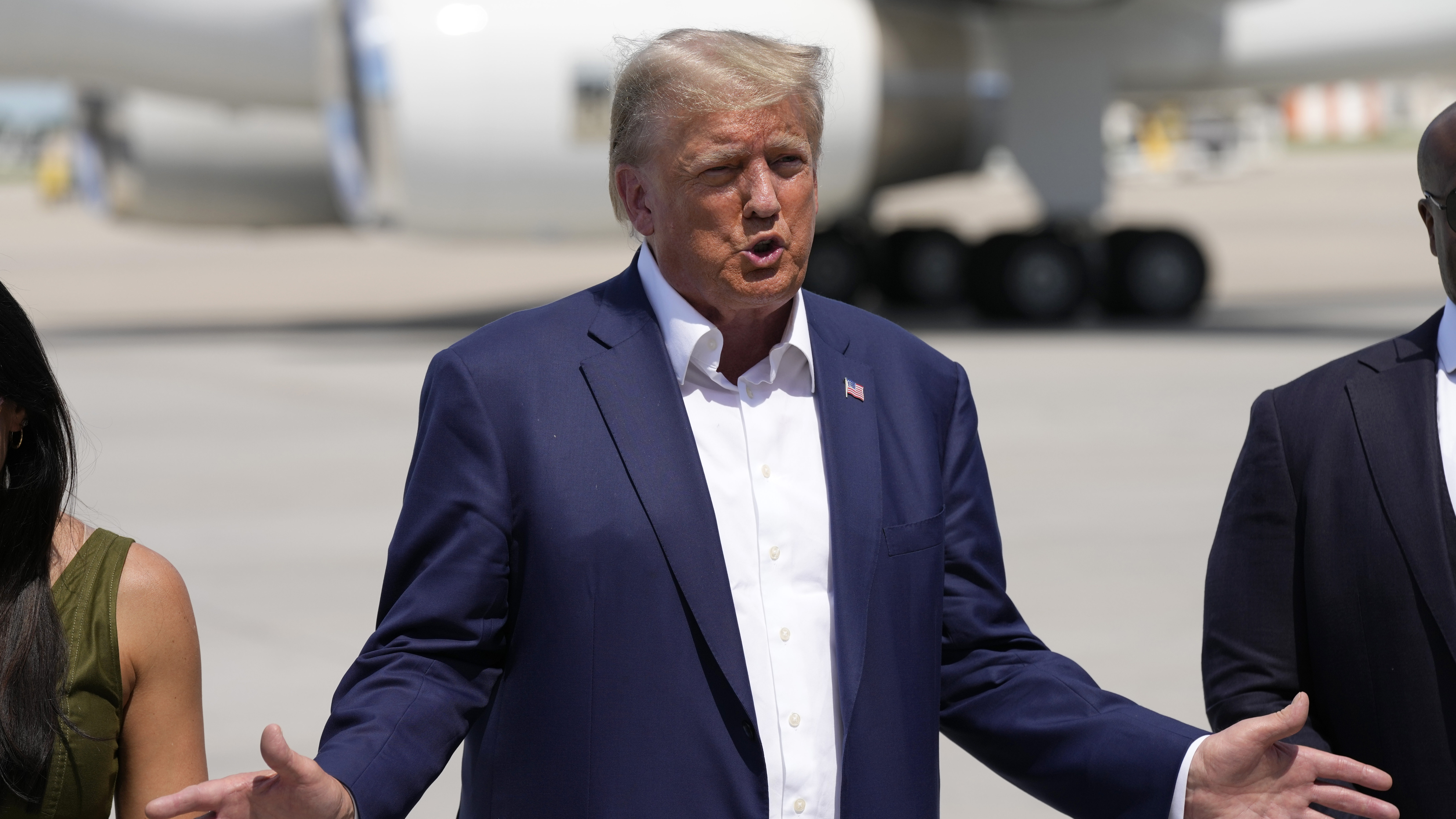 Republican presidential candidate former President Donald Trump speaks to reporters at the Des Moin...