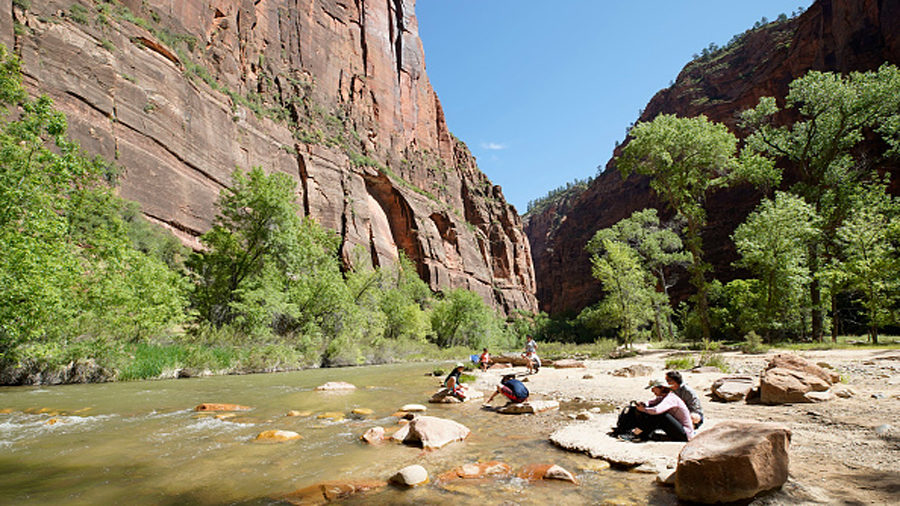 FILE: Family and kids play in the water of the North Fork of the Virgin River in Zion National Park...