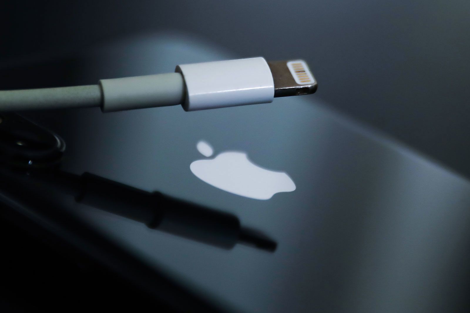 Lightning cable and Apple logo on iPhone are seen in this illustration photo taken in Krakow, Polan...