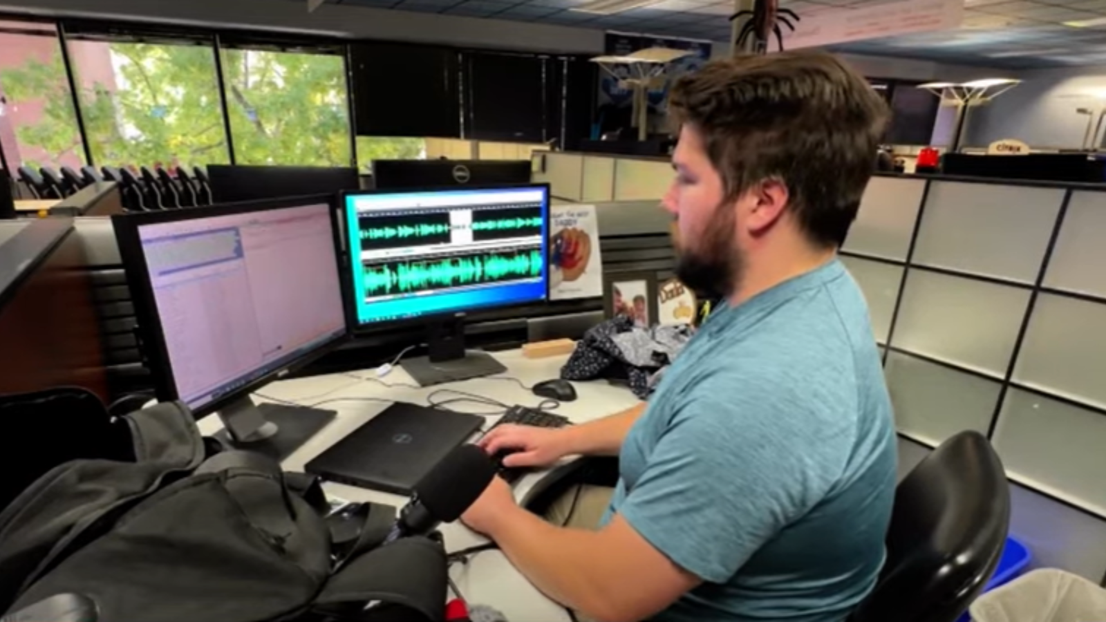 reporter adam small at his desk...