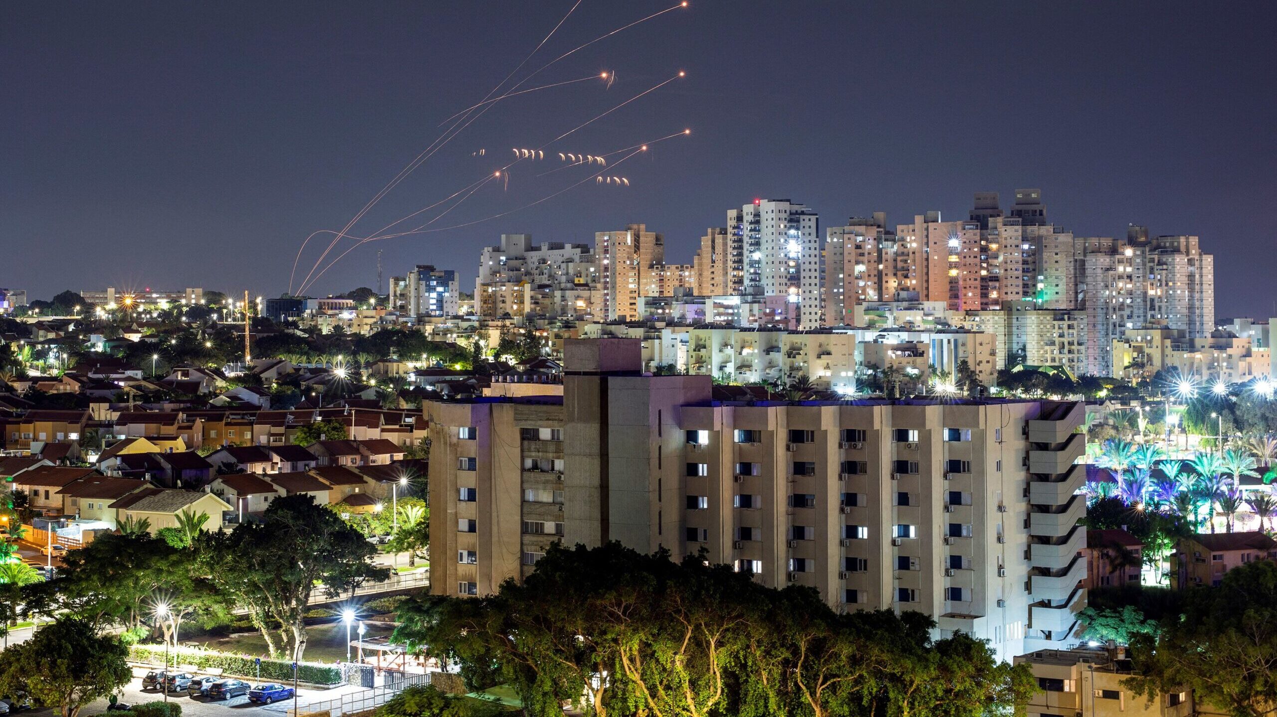 Israel's Iron Dome anti-missile system intercepts rockets launched from the Gaza Strip, as seen fro...