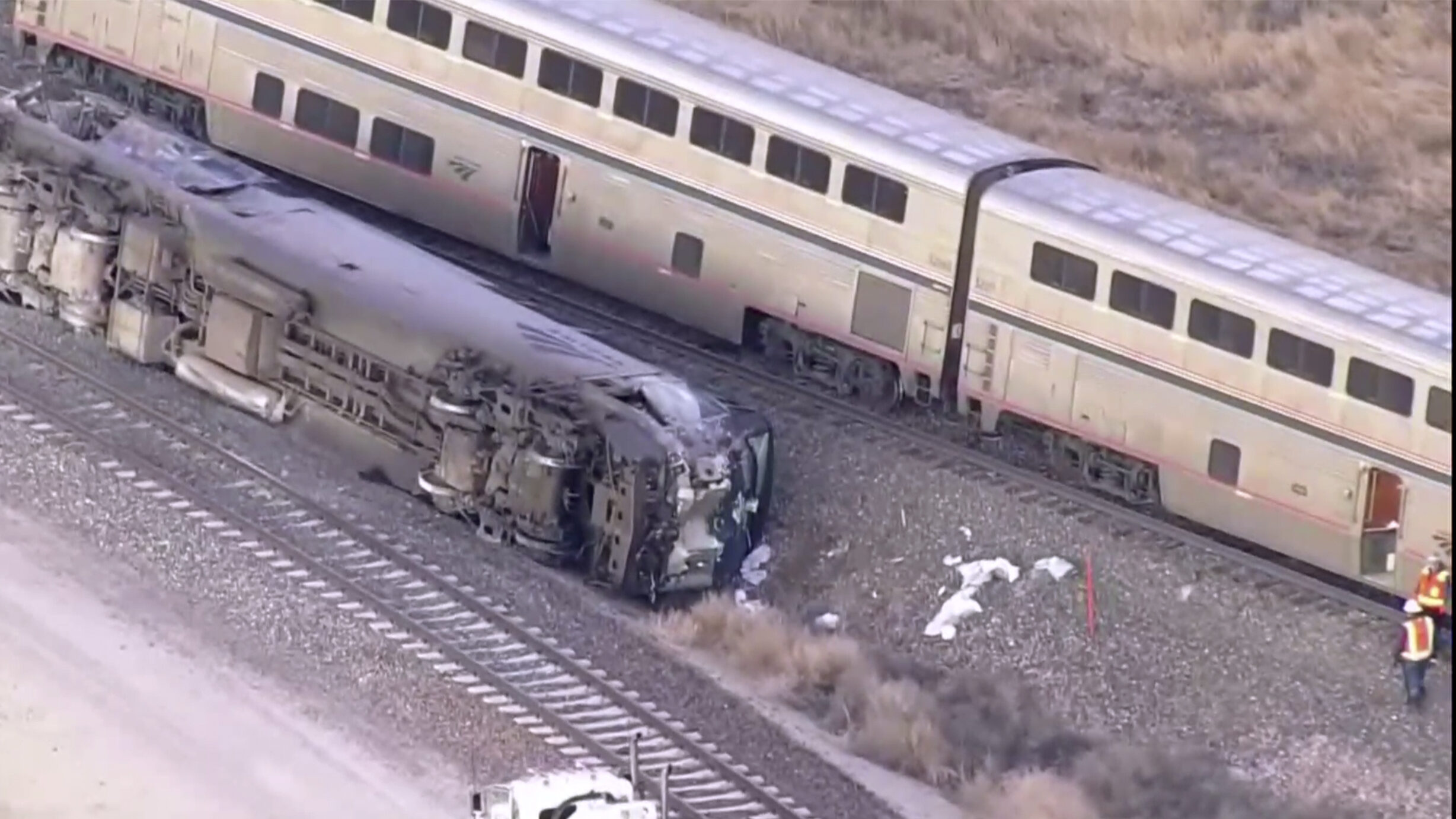 Emergency responders look over an Amtrak train derailment on Tuesday, Jan. 30, 2024 near Keenesburg...