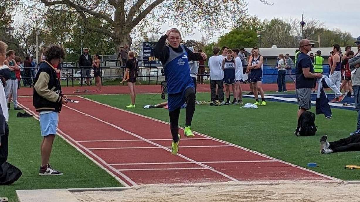 Alden Peterson, of Eden, competes in the long jump at the district championships at Bonneville Jr. ...
