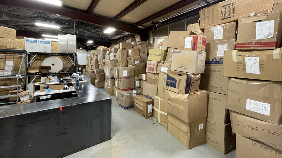 boxes labeled in Portuguese containing diapers, clothing and hygiene items meant to go to Brazil fl...