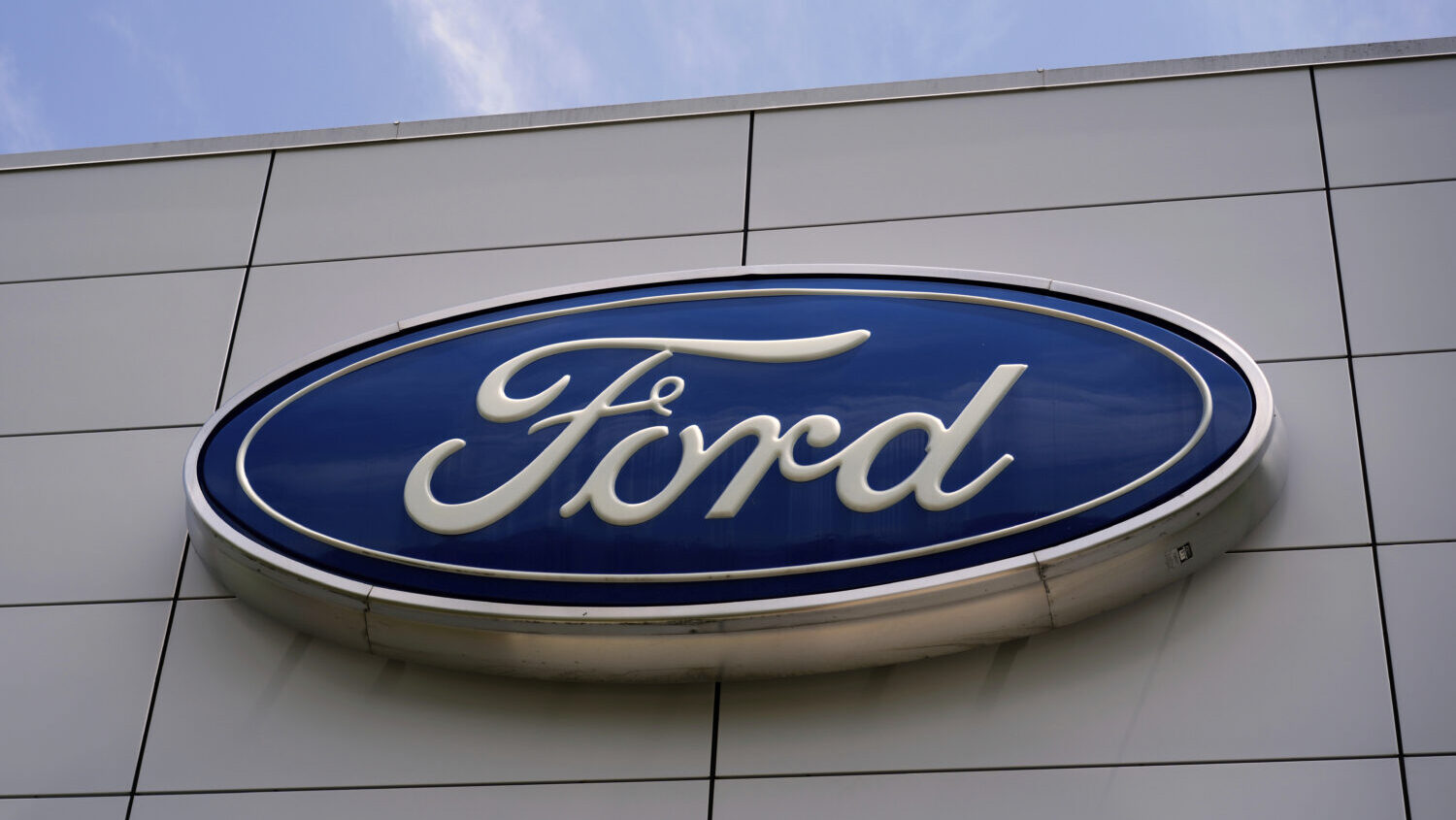 FILE - The Ford logo is seen above the entrance to the Ford Motor Company Kentucky Truck Plant, Wed...