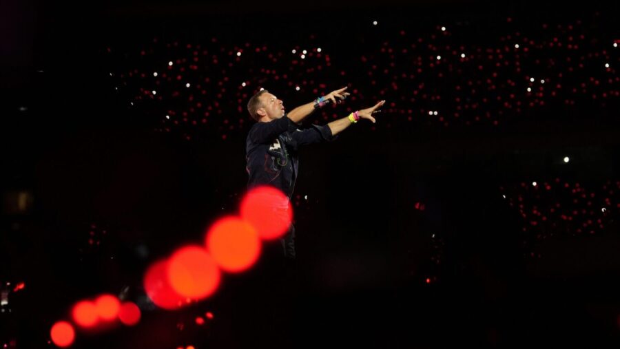 FILE - Chris Martin of Coldplay performs during the band's Music Of The Spheres World Tour at D. Y....