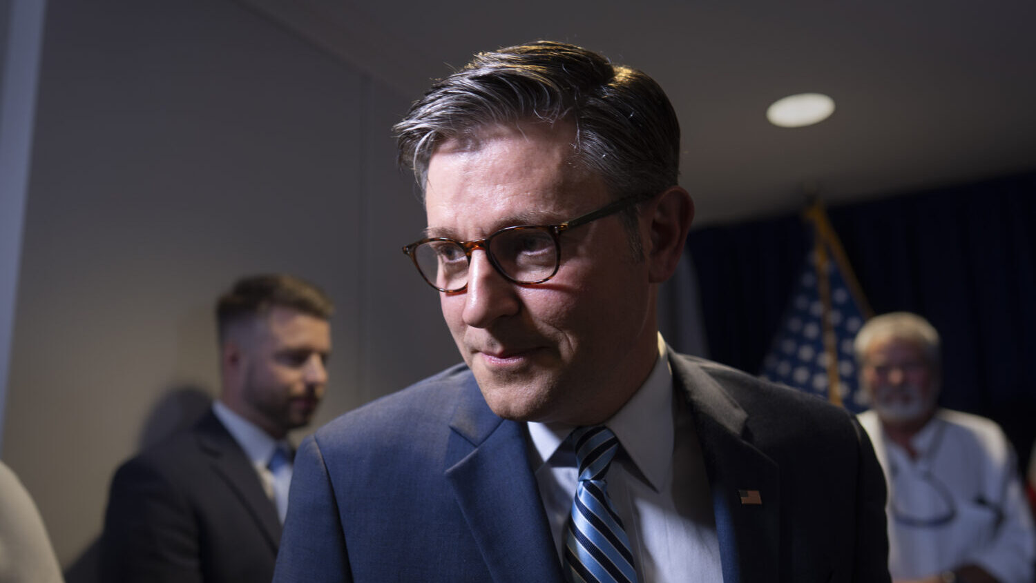 Speaker of the House Mike Johnson, R-La., departs a news conference at the Republican National Comm...