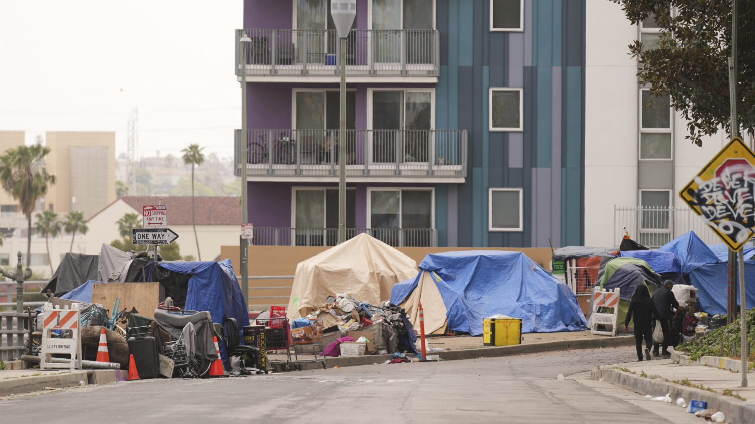 FILE - Tents are set up along a freeway in a homeless encampment, May 12, 2025, in Los Angeles. (AP...