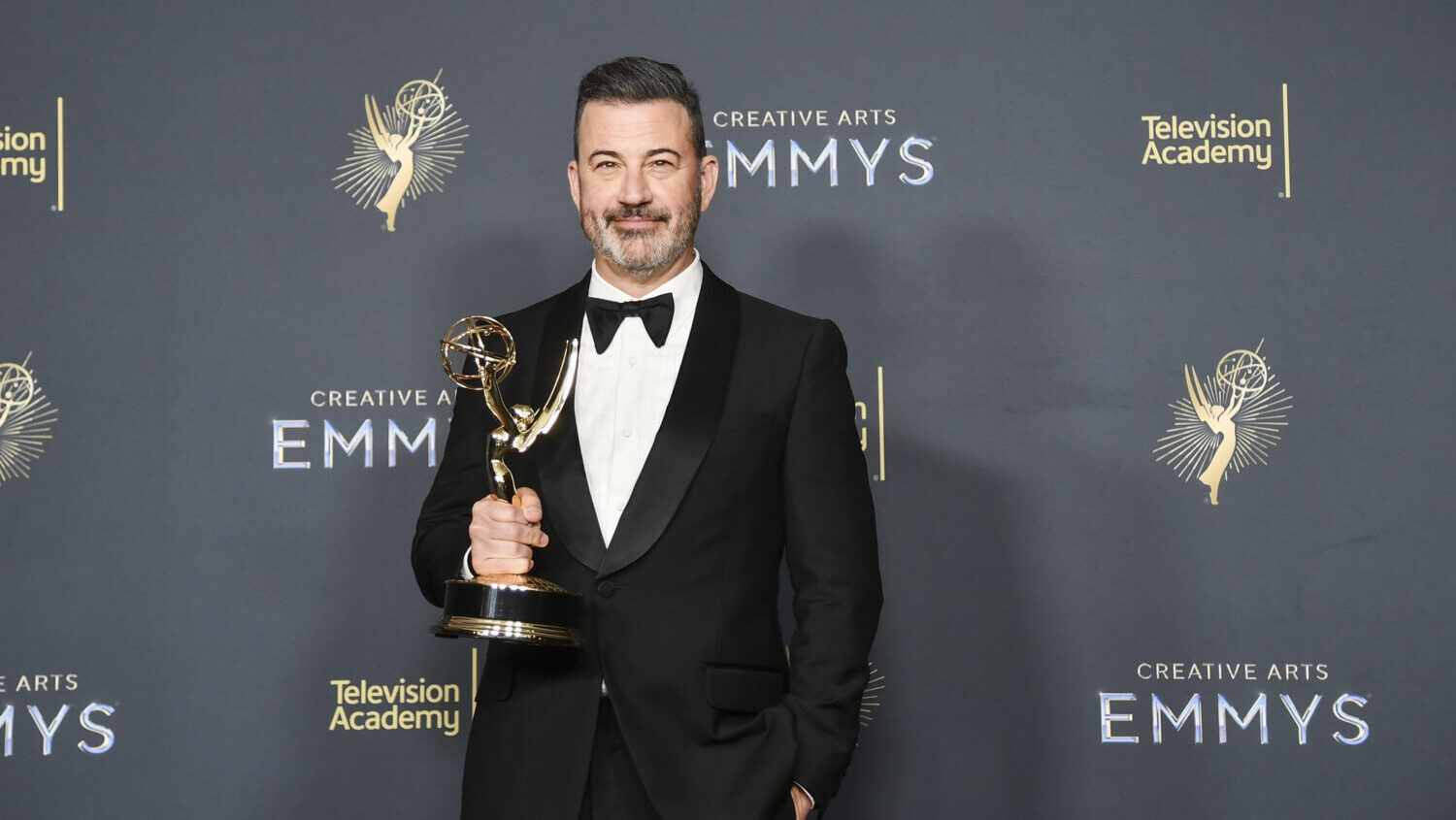 Jimmy Kimmel poses in the press room with the award for host for a game show for "Who Wants to Be a...