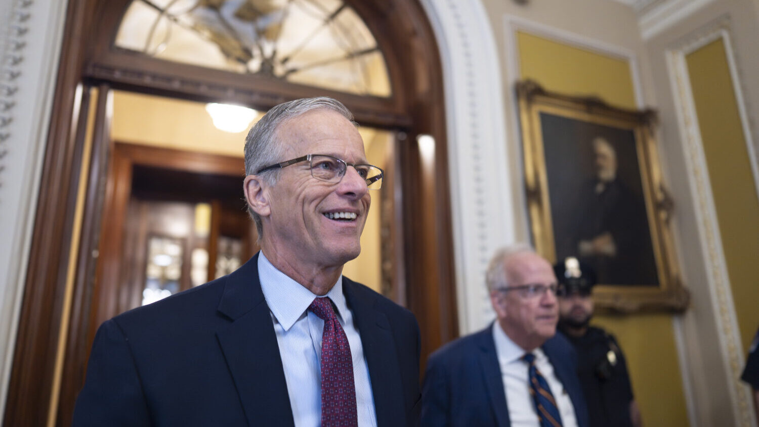 Senate Majority Leader John Thune, R-S.D., is met by reporters as he walks to his office while Cong...
