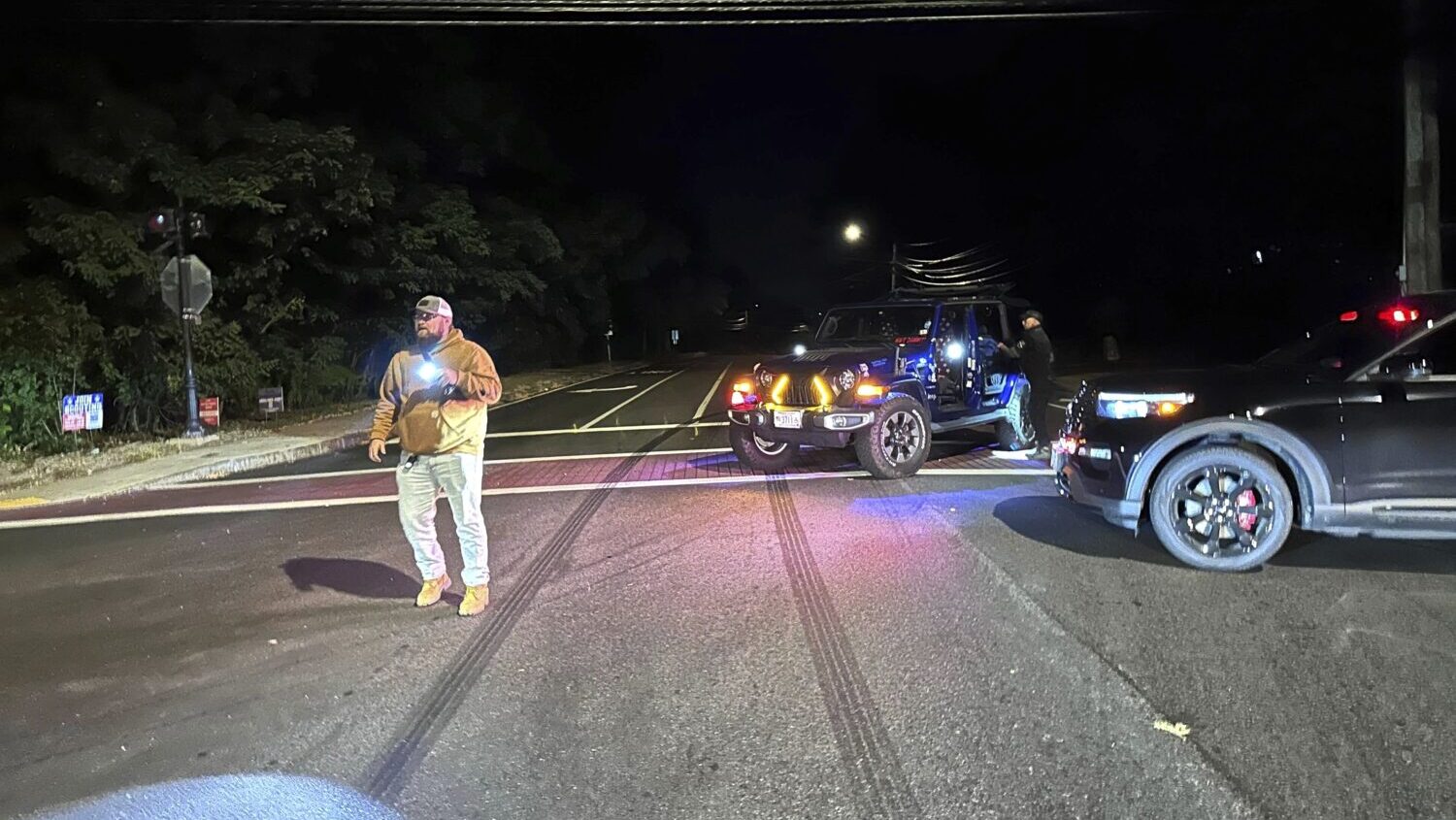 Police block a road to a country club where a shooting happened at Sky Meadow Country Club in Nashu...