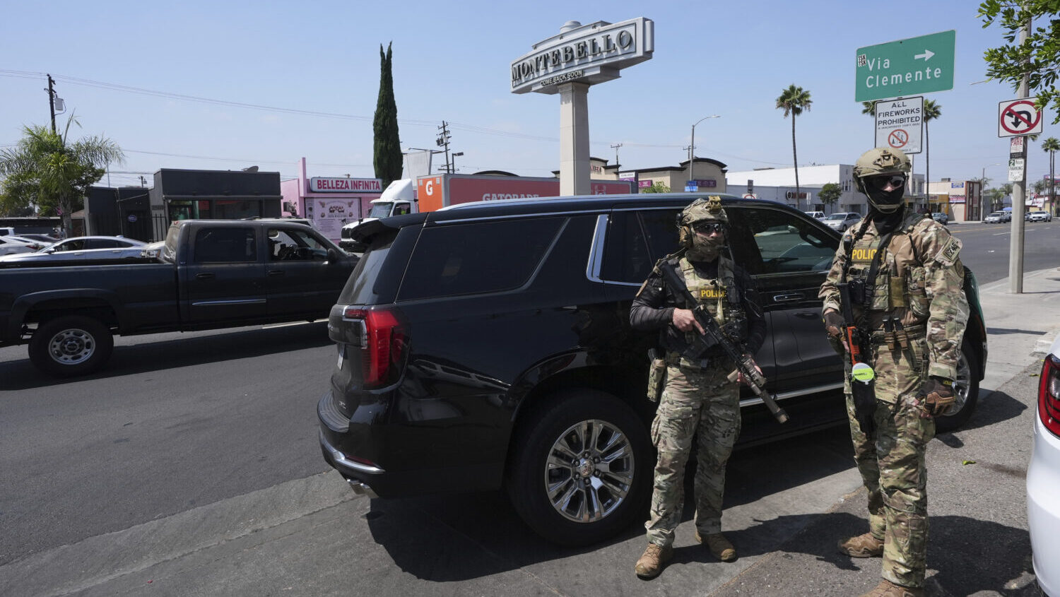 FILE - Immigration agents conduct an operation at a car wash Aug. 15, 2025, in Montebello, Calif....