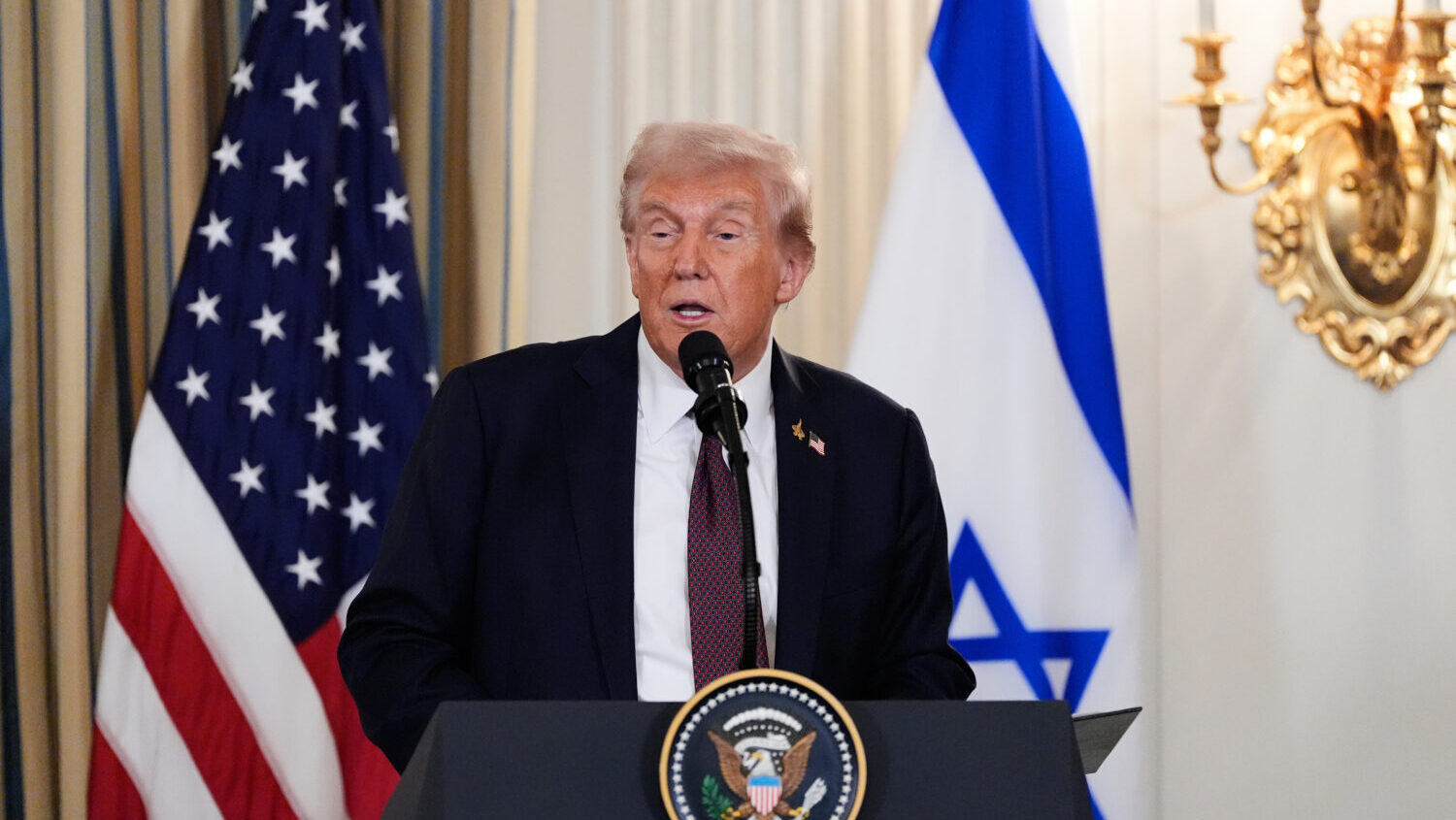 President Donald Trump speaks during a news conference with Israel's Prime Minister Benjamin Netany...