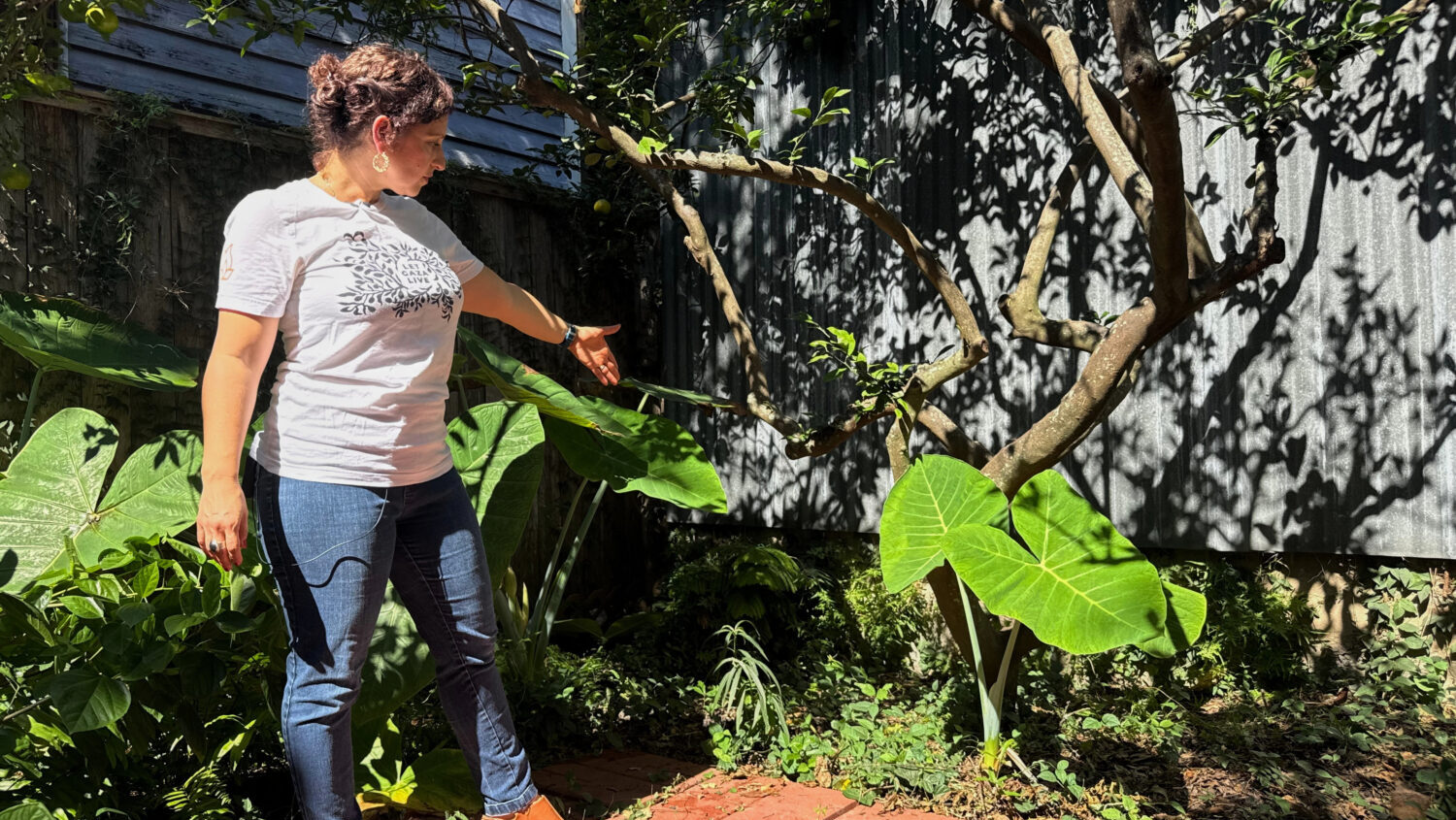 New Orleans resident Daniella Santoro points out the spot in her backyard where her family discover...