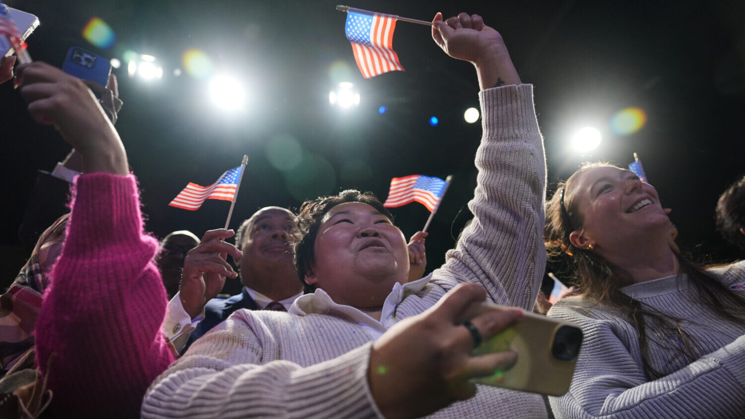 People cheer as Democrat Abigail Spanberger walks out on stage after she was declared the winner of...