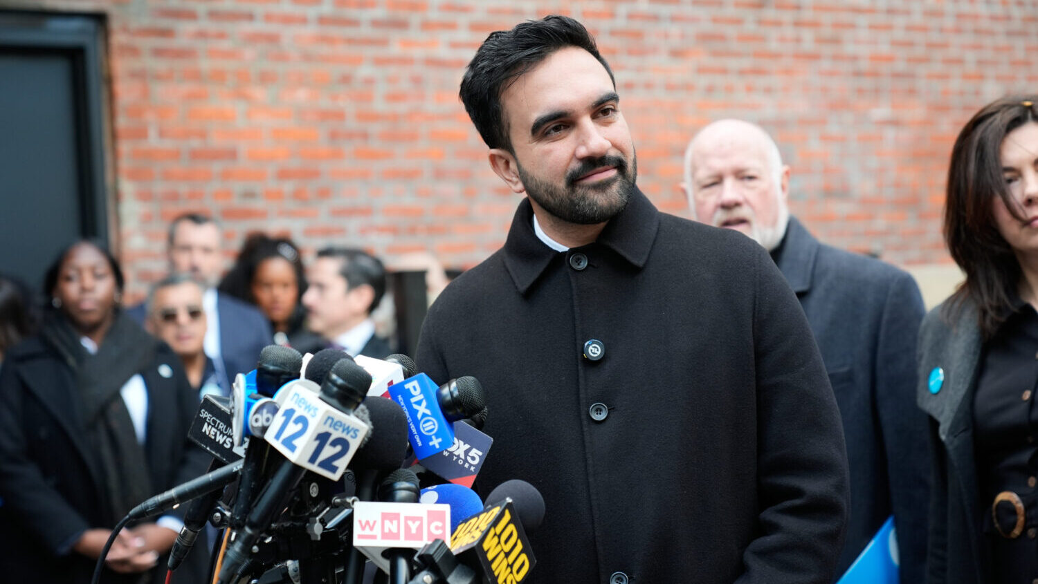 New York City mayor-elect Zohran Mamdani talks to reporters at a news conference in New York, Monda...