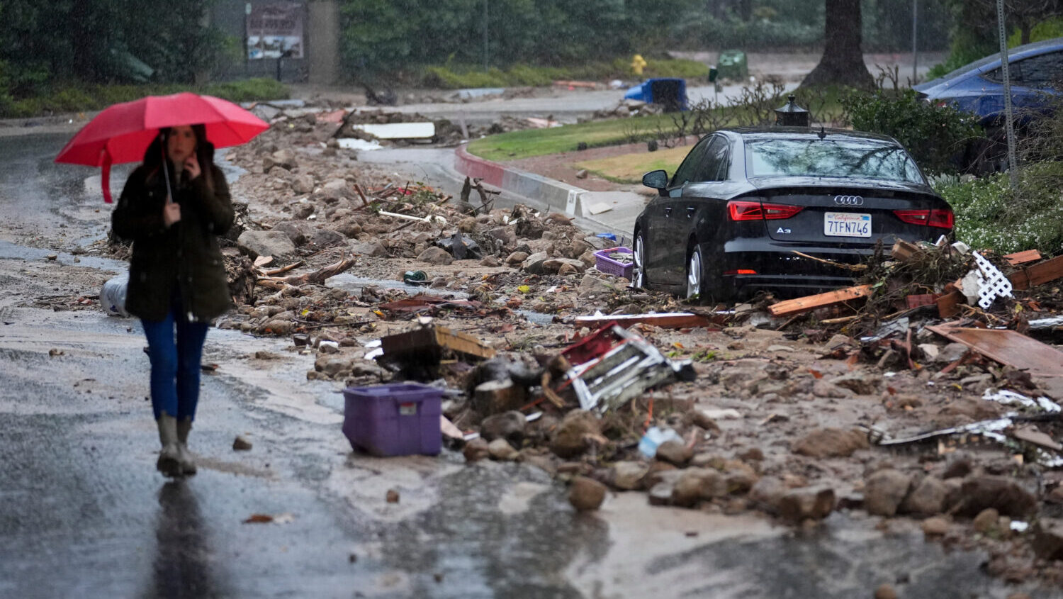 FILE - Mud and debris is strewn on Fryman Road during an atmospheric river Feb. 5, 2024, in Studio ...