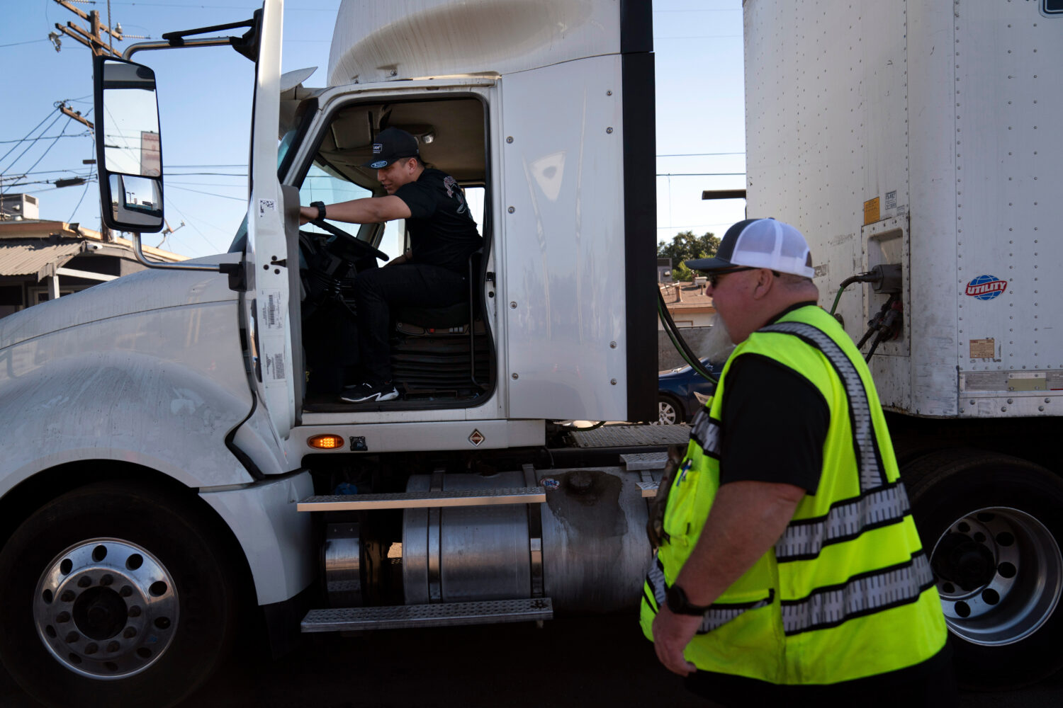FILE - A student driver gets on a truck as the instructor watches in Calif., Nov. 15, 2021. (AP Pho...