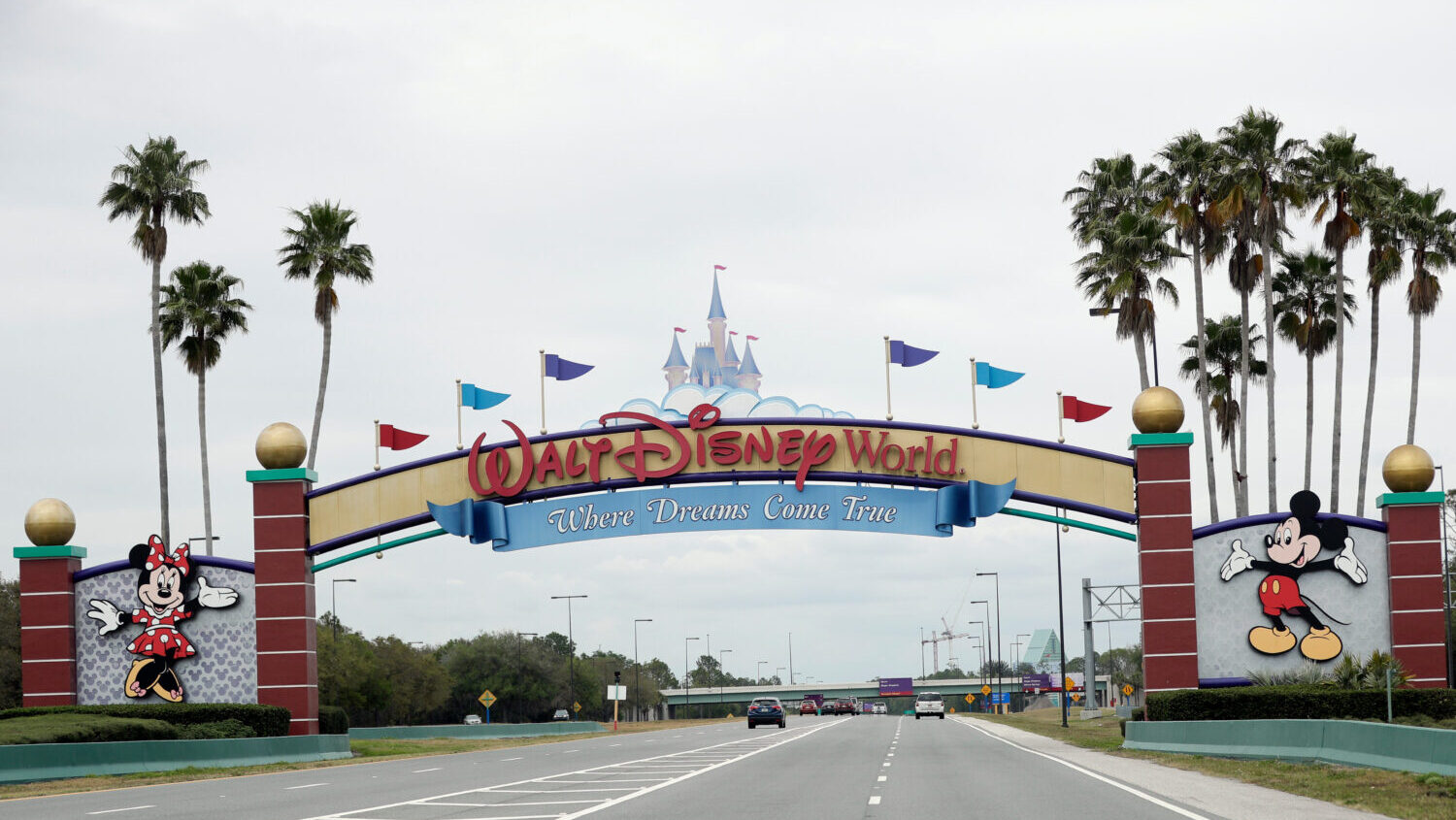 FILE - The road to the entrance of Walt Disney World, Monday, March 16, 2020, in Lake Buena Vista, ...