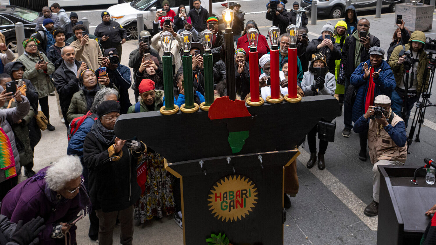 Philadelphians and visitors gather during the the lighting of the city's first kinara on the first ...