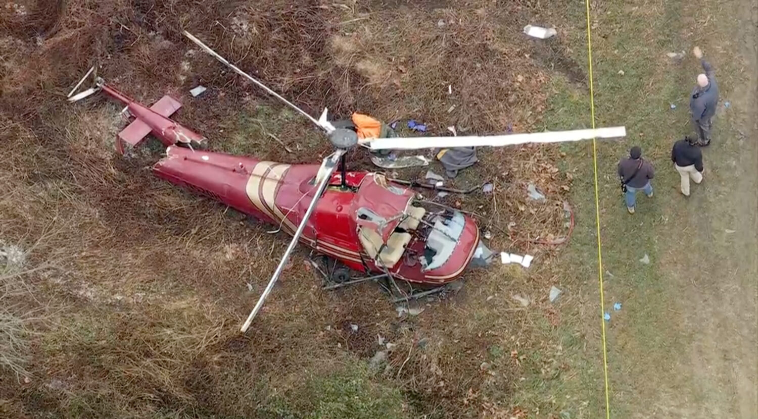 Authorities look over the scene after two helicopters crashed in Hammonton, N.J., on Sunday, Dec. 2...