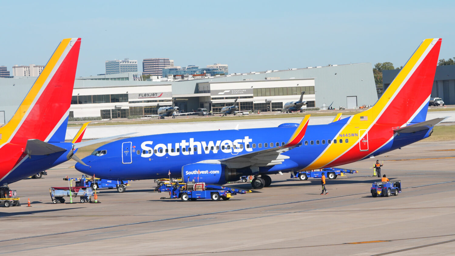 A Southwest Airlines jet pulls into a gate at Dallas Love Field Airport Tuesday, Nov. 11, 2025, in ...