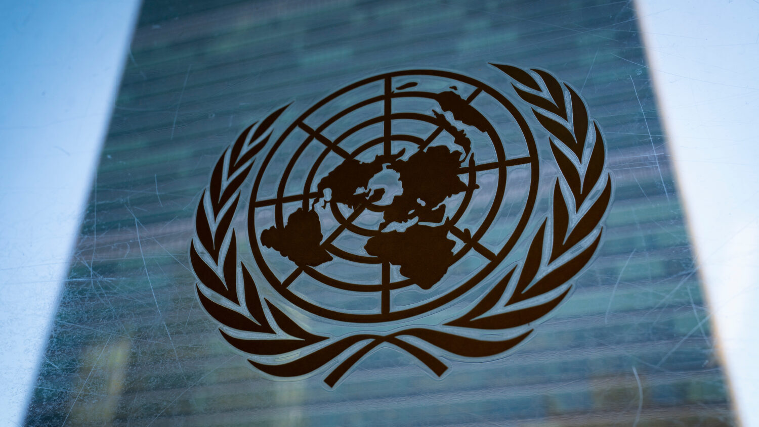 The symbol of the United Nations is displayed outside the Secretariat Building, Feb. 28, 2022, at U...