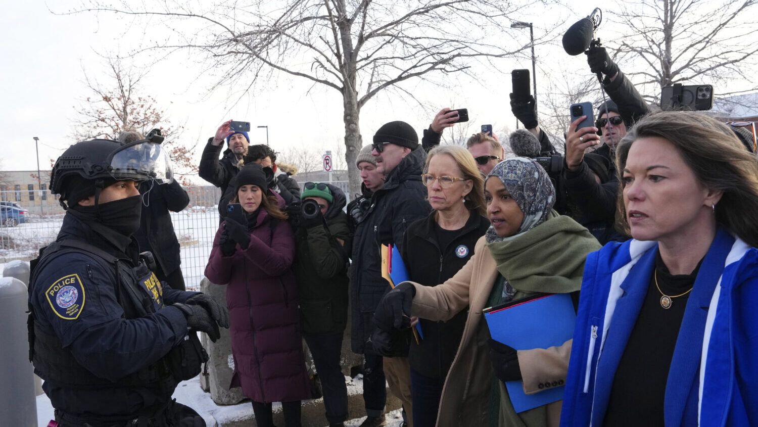Rep. Kelly Morrison D-Minn., center, Rep. Ilhan Omar, D-Minn., second from the right, and Rep. Angi...