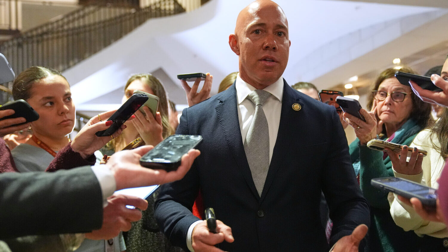 Rep. Brian Mast, R-Fla., speaks to reporters at the U.S. Capitol Monday, Jan. 5, 2026, in Washingto...