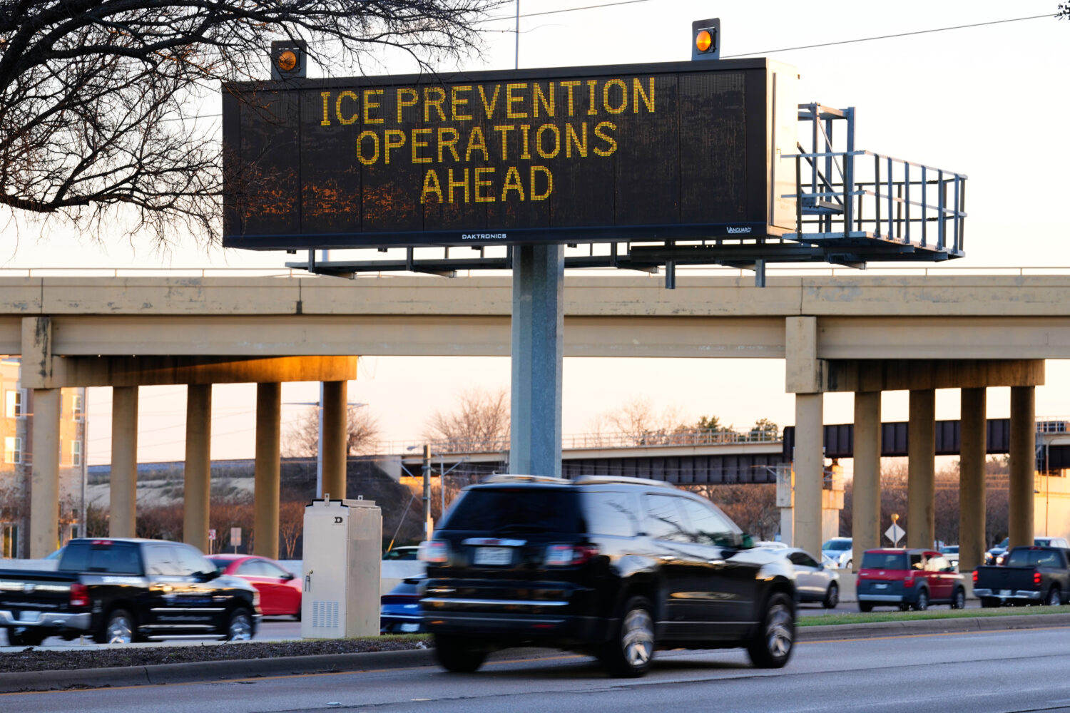 A digital billboard along Highway 75 warns of road preparations for upcoming inclement weather expe...