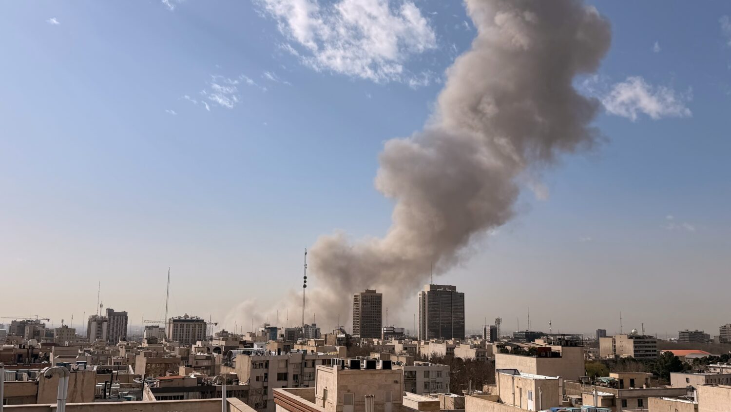 Smoke rises on the skyline after an explosion in Tehran, Iran, Saturday, Feb. 28, 2026....