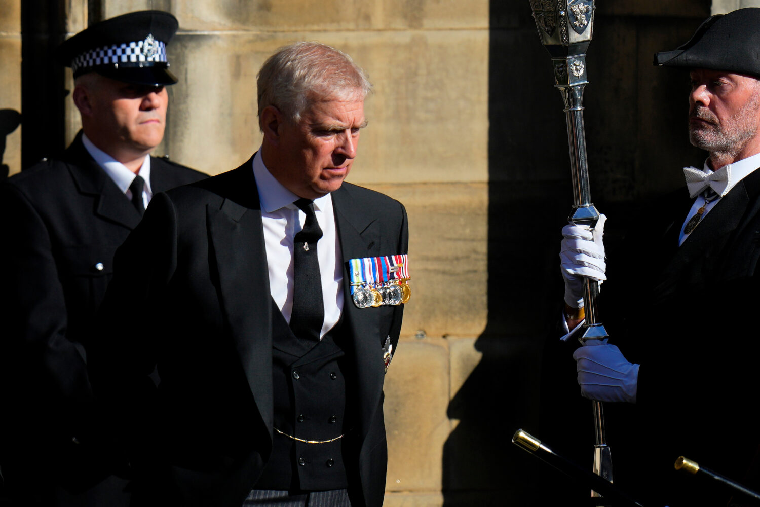 FILE - Prince Andrew leaves St. Giles Cathedral after the arrival of the coffin containing the rema...