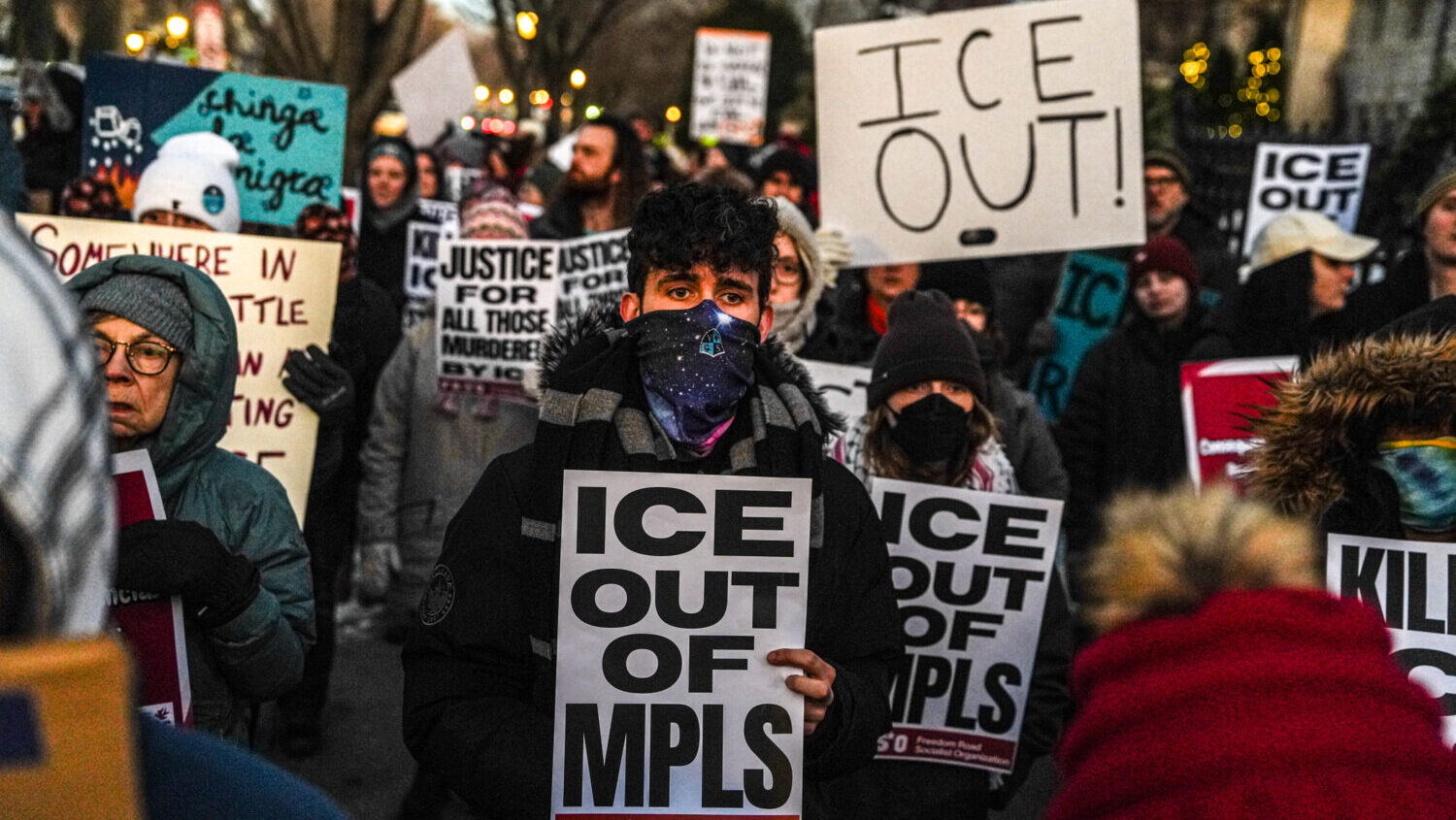 People participate in an anti-ICE protest outside of the Governors Residence, Friday, Feb. 6, 2026,...