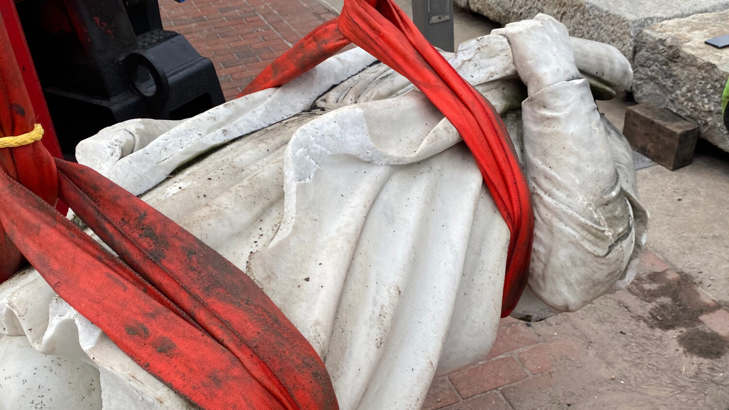 In this photo provided by Nino Mangione, a statue of Christopher Columbus is pulled out of the Inne...