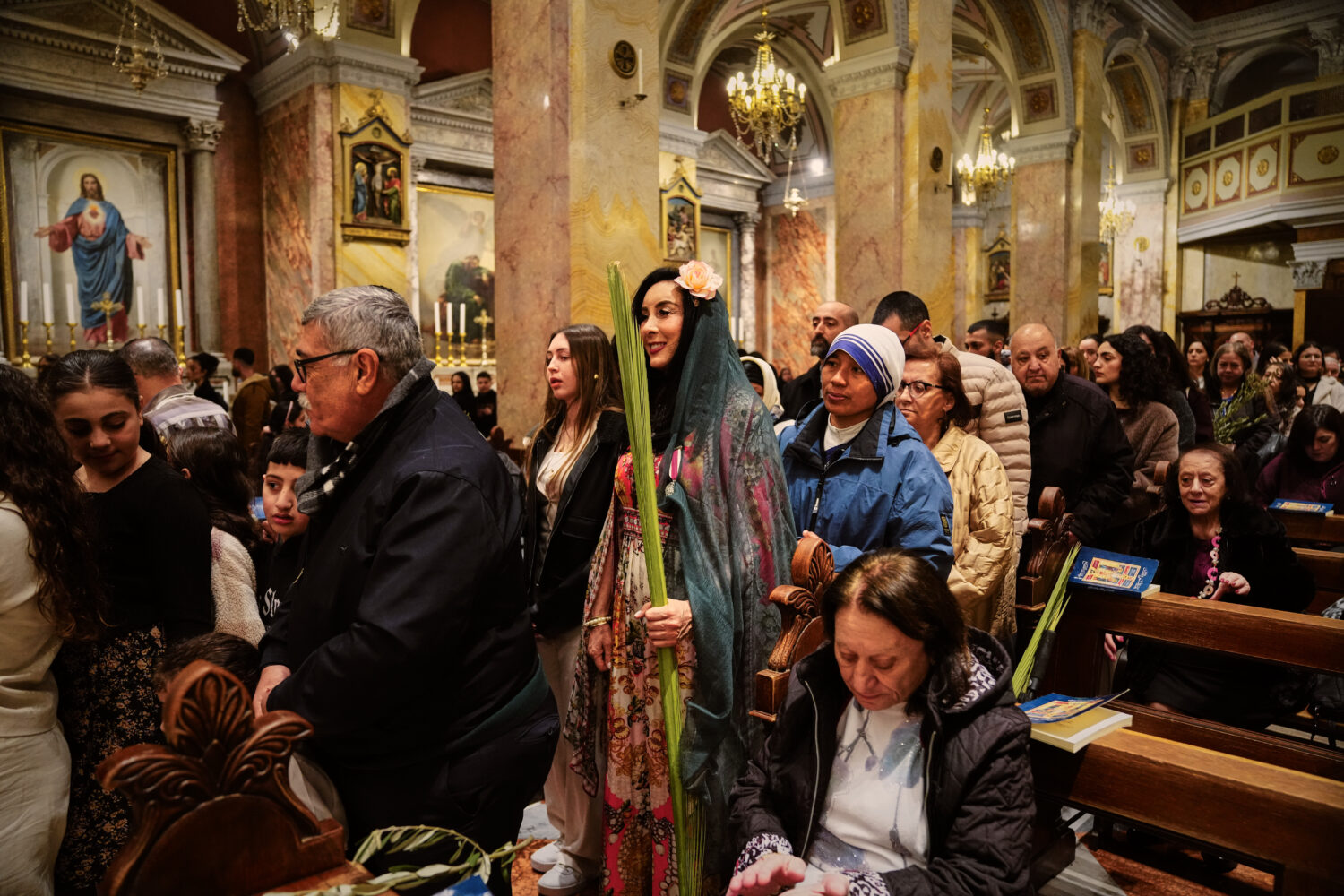 Catholic faithfuls attend a Palm Sunday mass at the Monastery of Saint Saviour in Jerusalem's Old C...