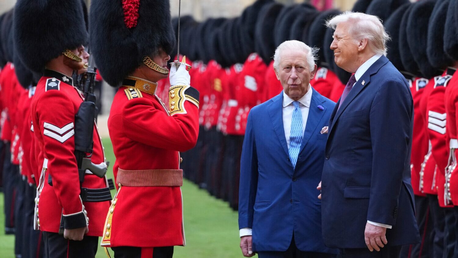 FILE - President Donald Trump and Britain's King Charles III review the Guard of Honour after the a...
