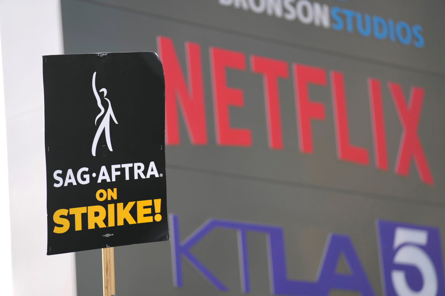 The screenwriters union and Hollywood studios reached a surprise four-year tentative agreement afte...