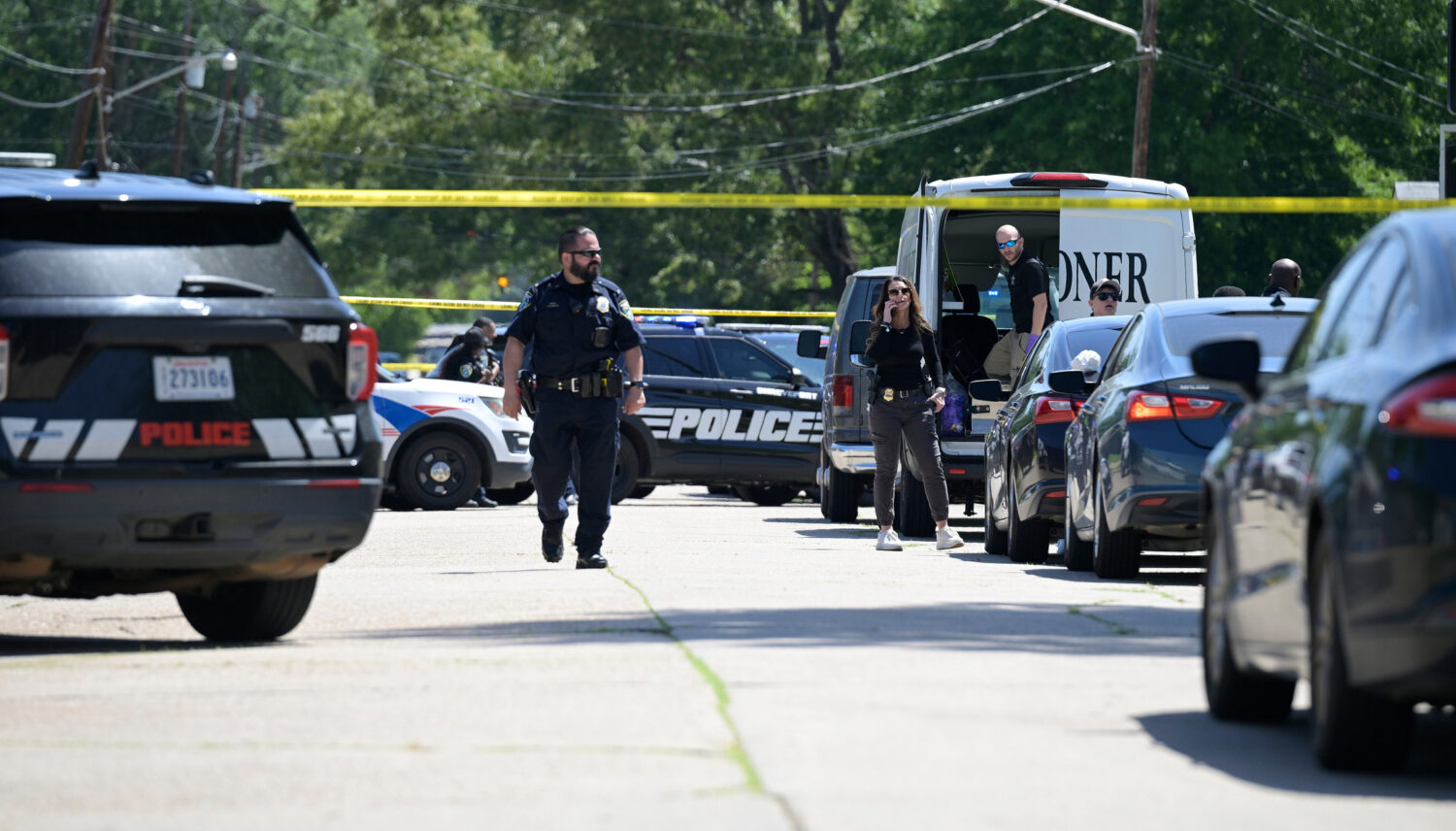 Police tape runs across 79th Street in Shreveport, La., Sunday, April 19, 2026, as police work at t...