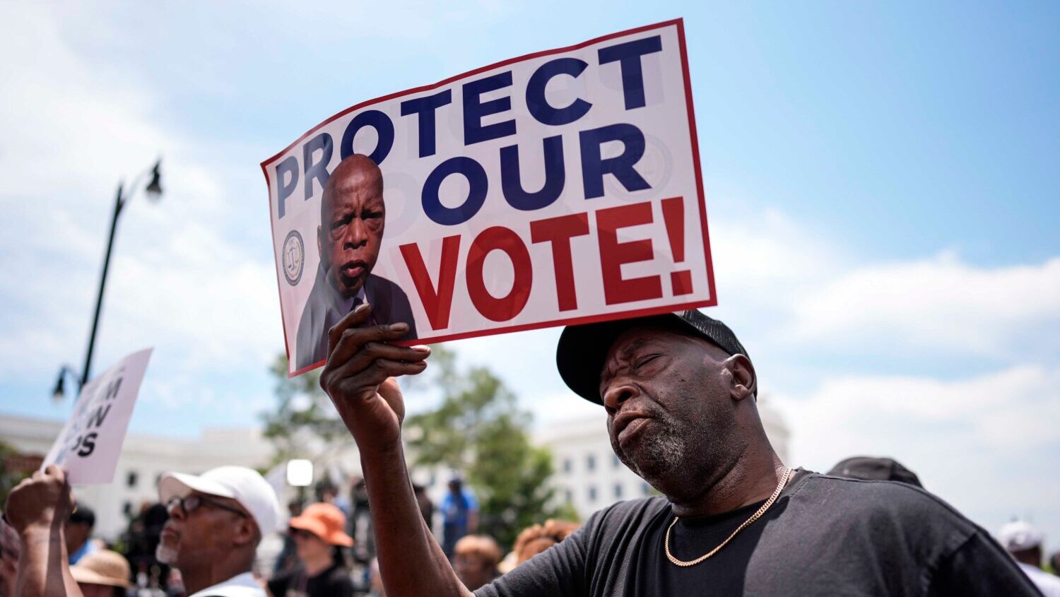 Aaron McGuire sings a spirtual song during a voting rally, Saturday, May 16, 2026, in Montgomery, A...