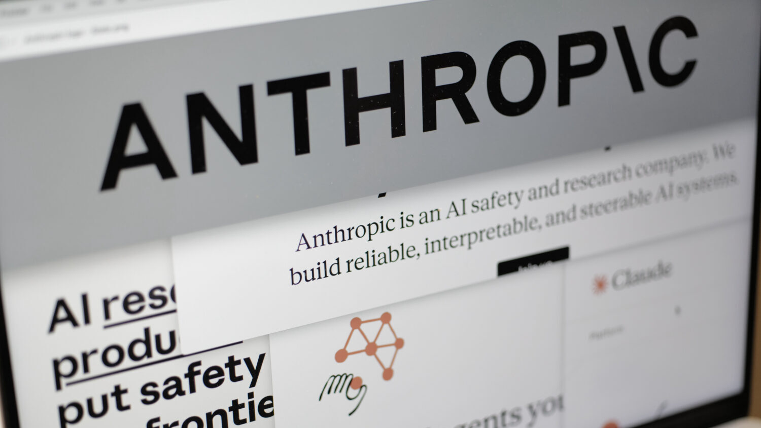 FILE - Pages from the Anthropic website and the company's logo are displayed on a computer screen i...