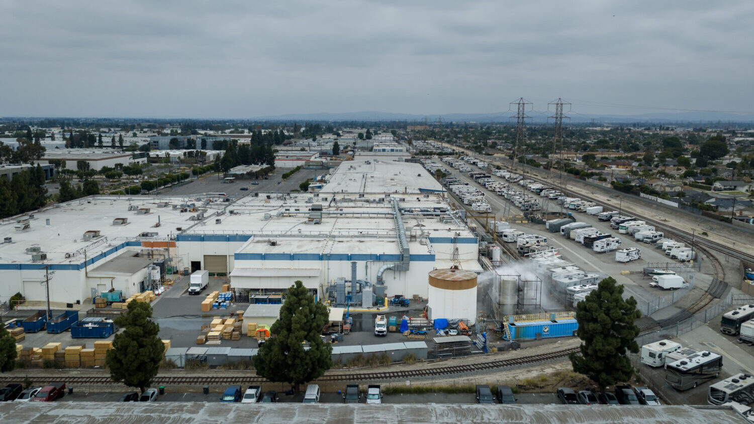 Water is sprayed on a damaged tank at GKN Aerospace in Garden Grove, Calif., on Sunday, May 24, 202...
