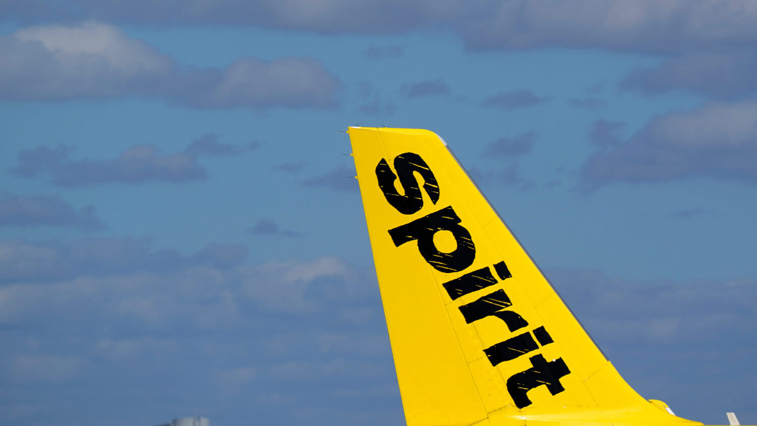 FILE - The tail of a Spirit Airlines Airbus A320 is shown as the plane prepares to take off from Fo...
