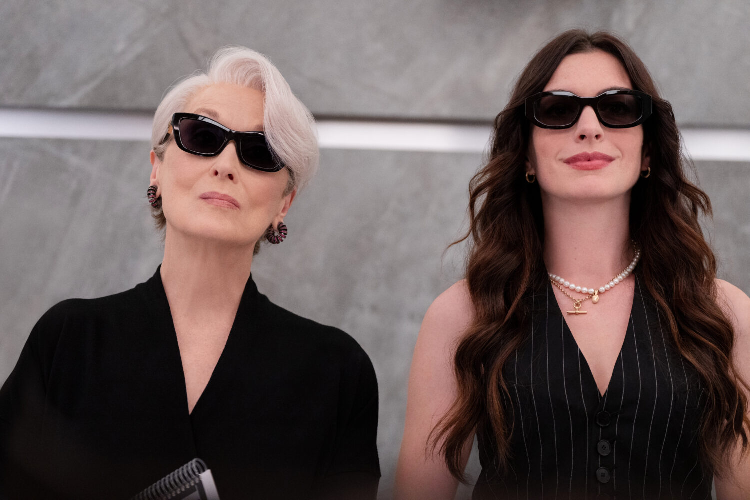 This image released by 20th Century Studios shows Meryl Streep, left, and Anne Hathaway in a scene ...